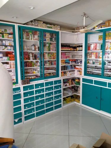 Rows of sealed homeopathic medicine bottles on pharmacy shelves