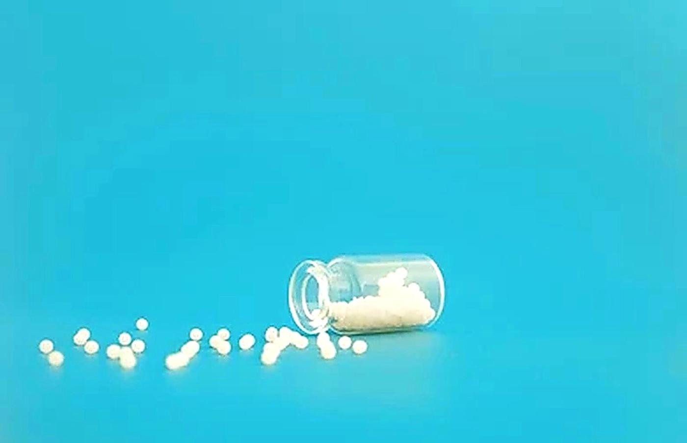 Homeopathic globules and bottle close-up