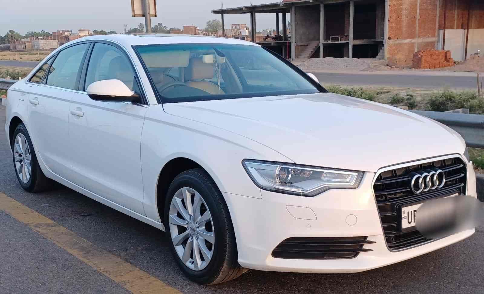 White Audi luxury rental car from Awadh Travels fleet, premium car hire Lucknow