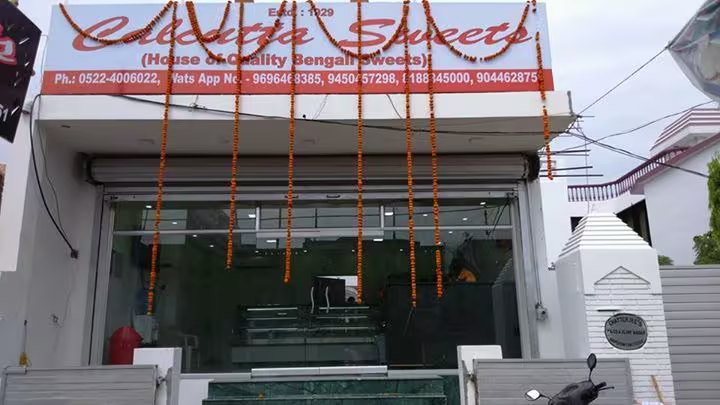 Shopfront decorated with garlands, Calcutta Sweets Lucknow