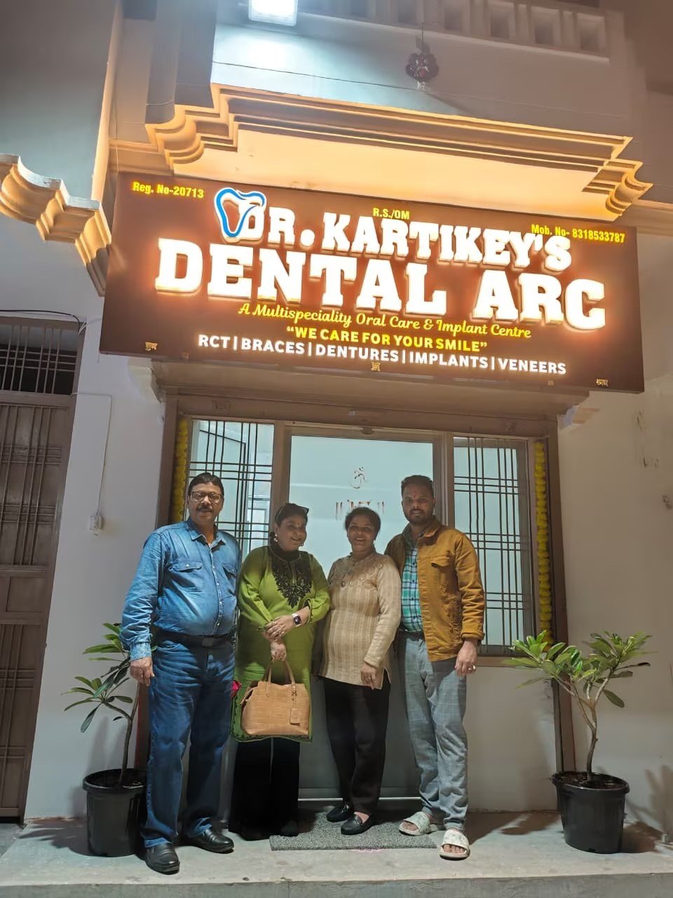 Dental Arc clinic front at night with patients waiting