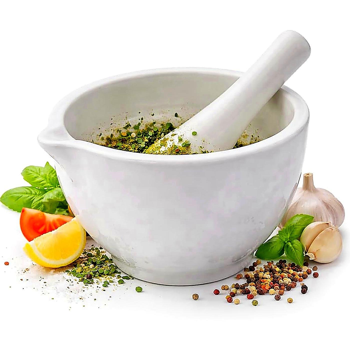 Mortar and pestle with fresh ayurvedic herbs