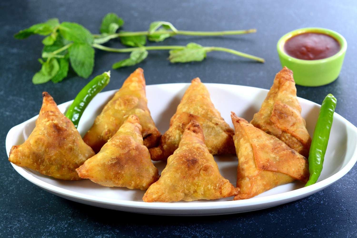 Samosa plate with ketchup at Durga Khasta Corner Lucknow
