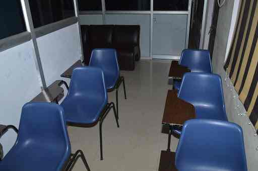 Classroom with chairs arranged at Excellent Tutorial Classes