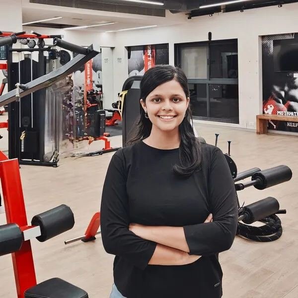 Female personal trainer coaching in gym