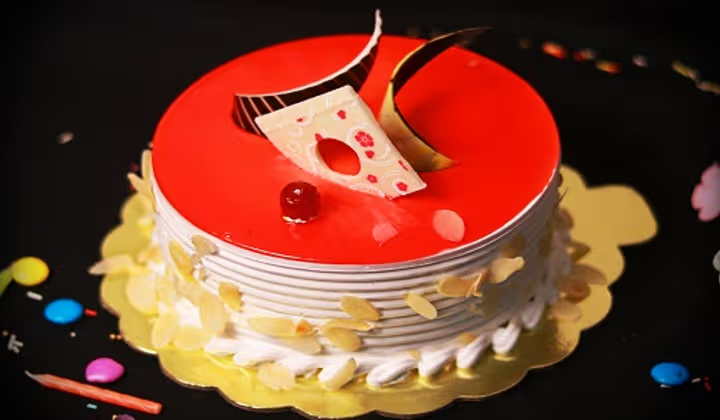Decorated red celebration cake by Globe Bakery Lucknow