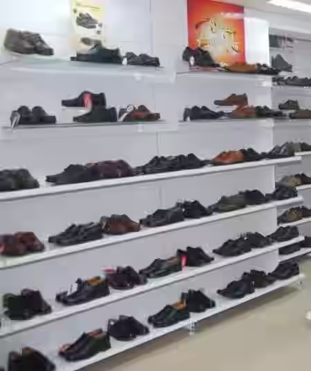 Shoe store wall shelves with formal shoes