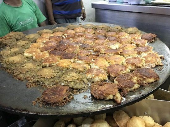 Aloo tikki frying on big tawa at Jain Chaat Bhandar, Lalbagh Lucknow
