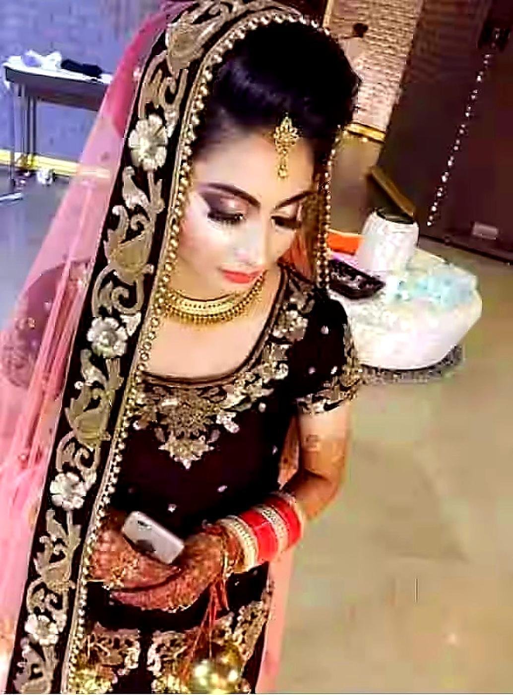 Bridal makeup look in dark lehenga at Jannat studio Lucknow
