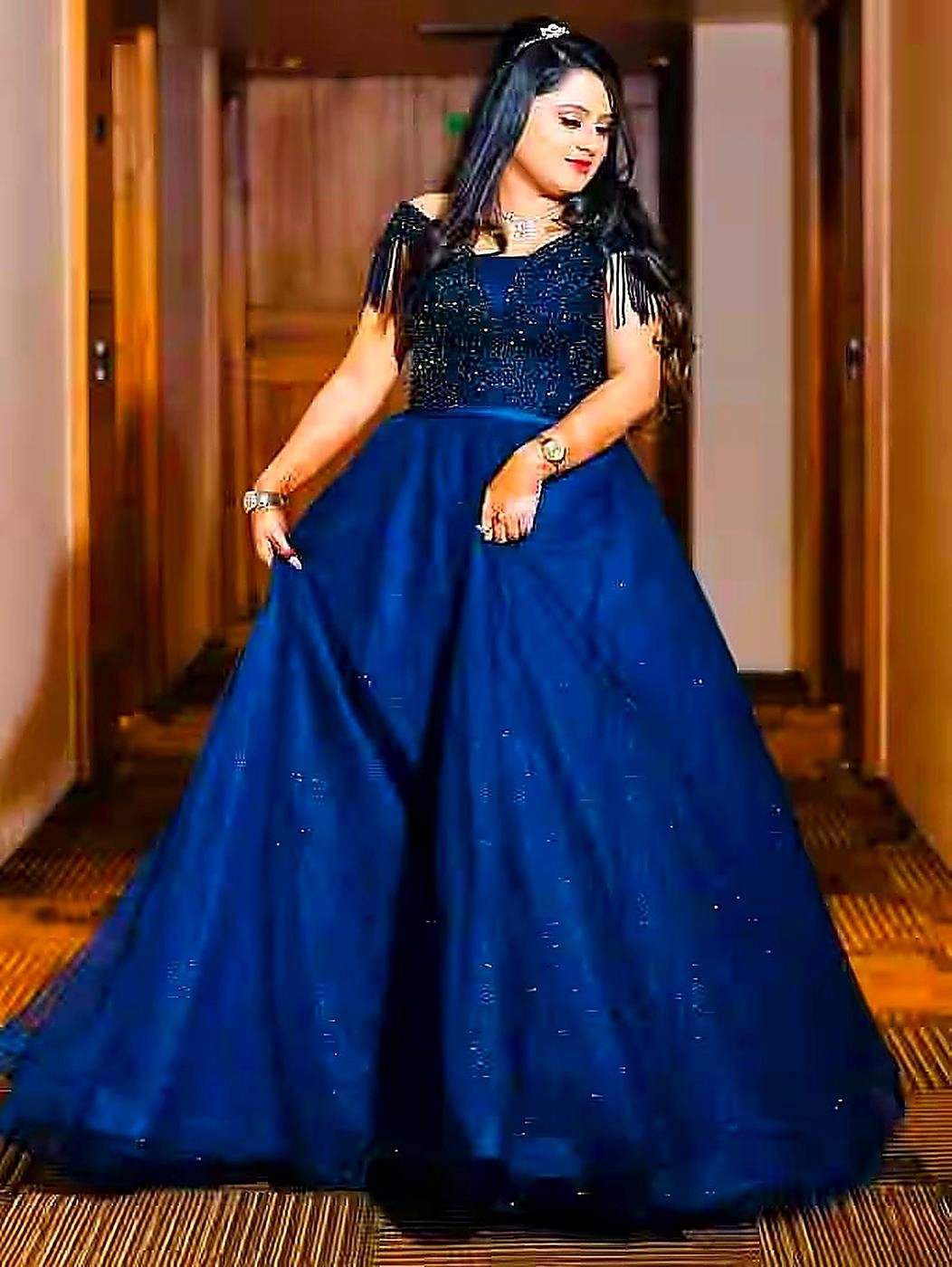 Engagement reception look in blue gown by Jannat Makeover