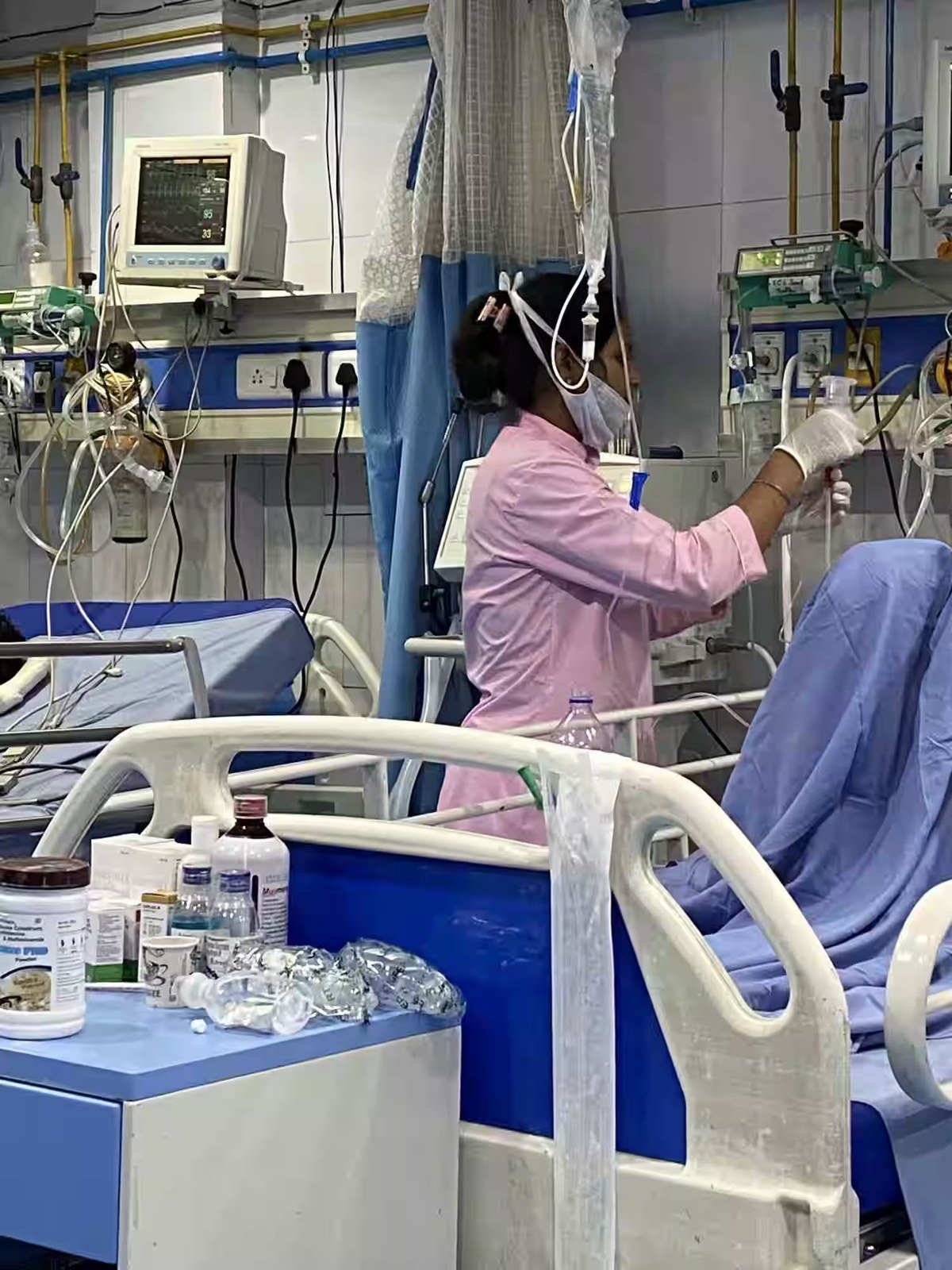 Nurse managing an IV line in the ward at Lucknow Hospital and Maternity Centre