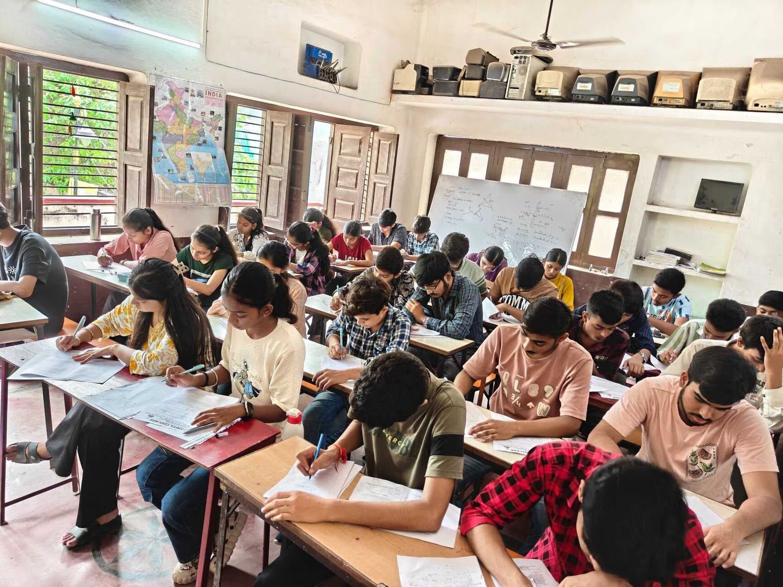 Students writing a practice test in the examination hall