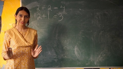 Maths class running on the green board