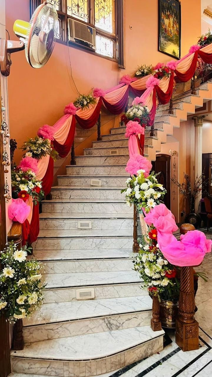 Staircase floral and drape decoration by Nits Events, wedding decorator Lucknow