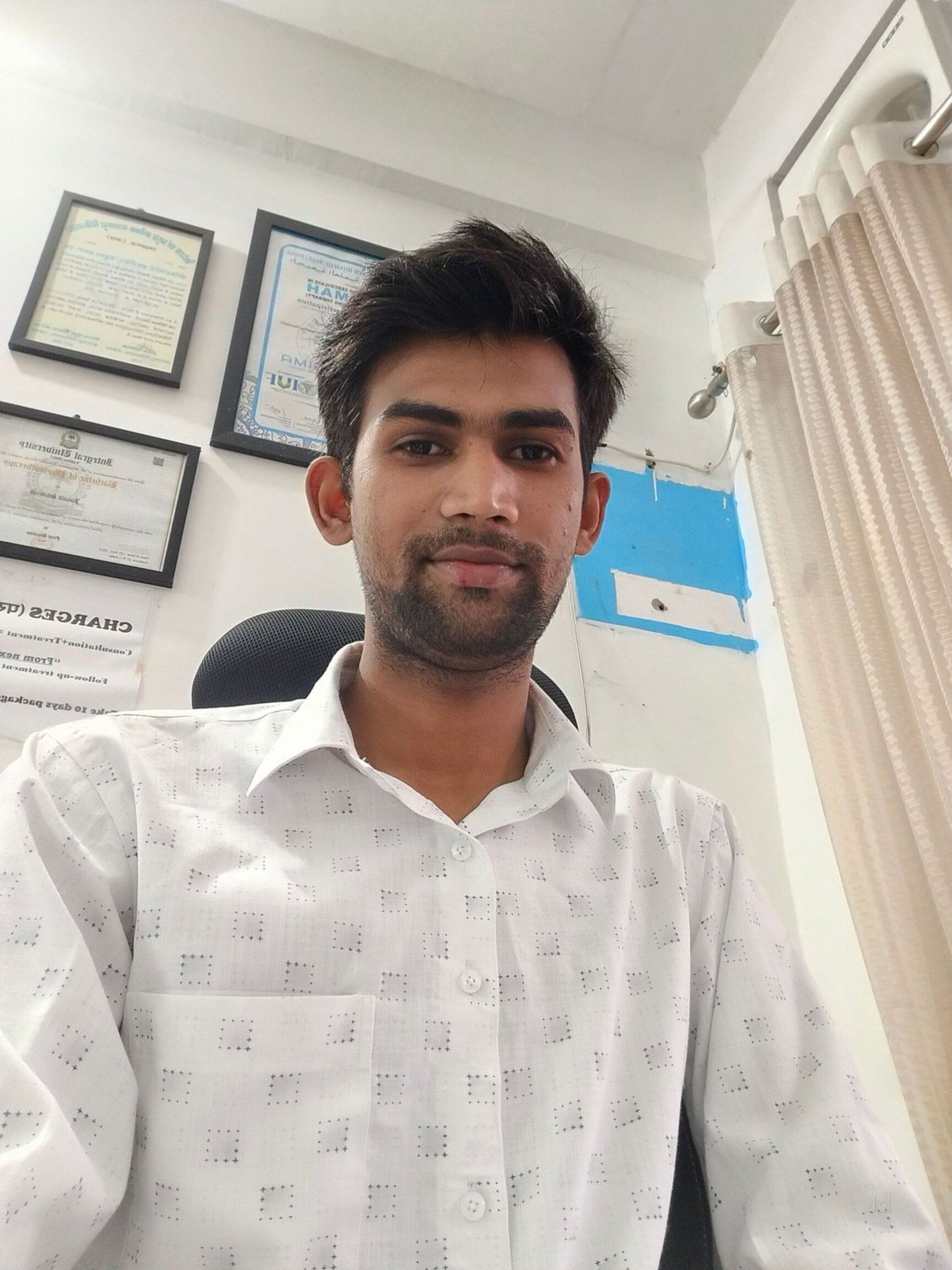 Physiotherapist at Physio Ilaj Clinic with certificates and patient records, Lucknow