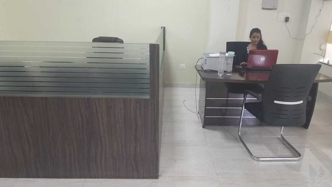 P K Srivastava and Associates office interior with staff at workstations, Lucknow CA firm