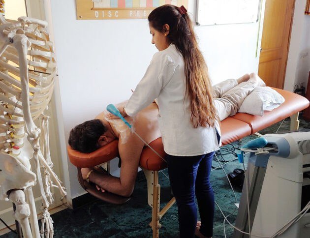 Ultrasound therapy being applied on a patient's back
