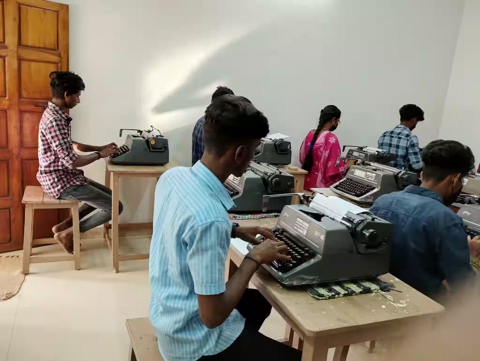 Students practising on typewriters in the institute