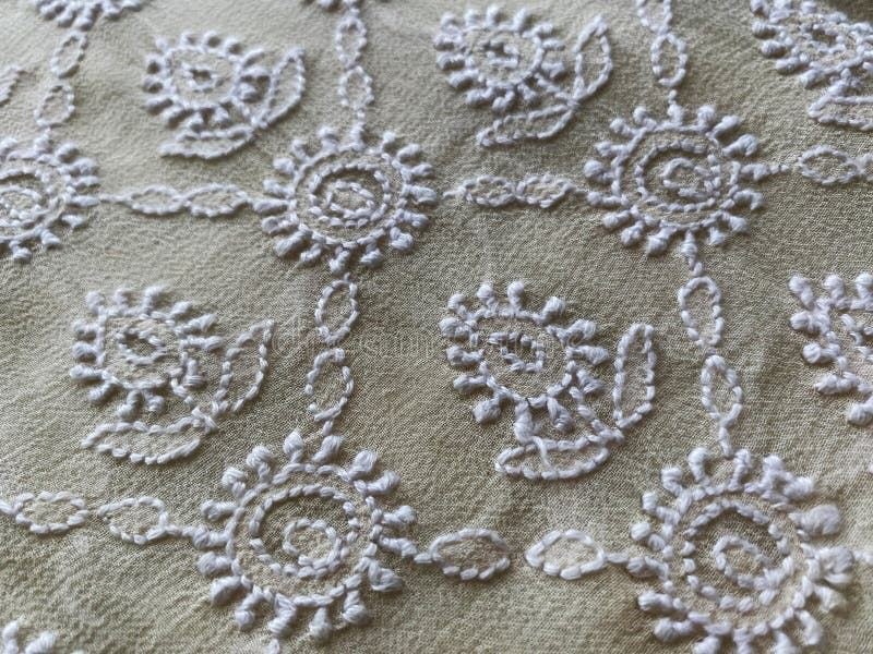 Close-up of white chikankari thread embroidery stitches