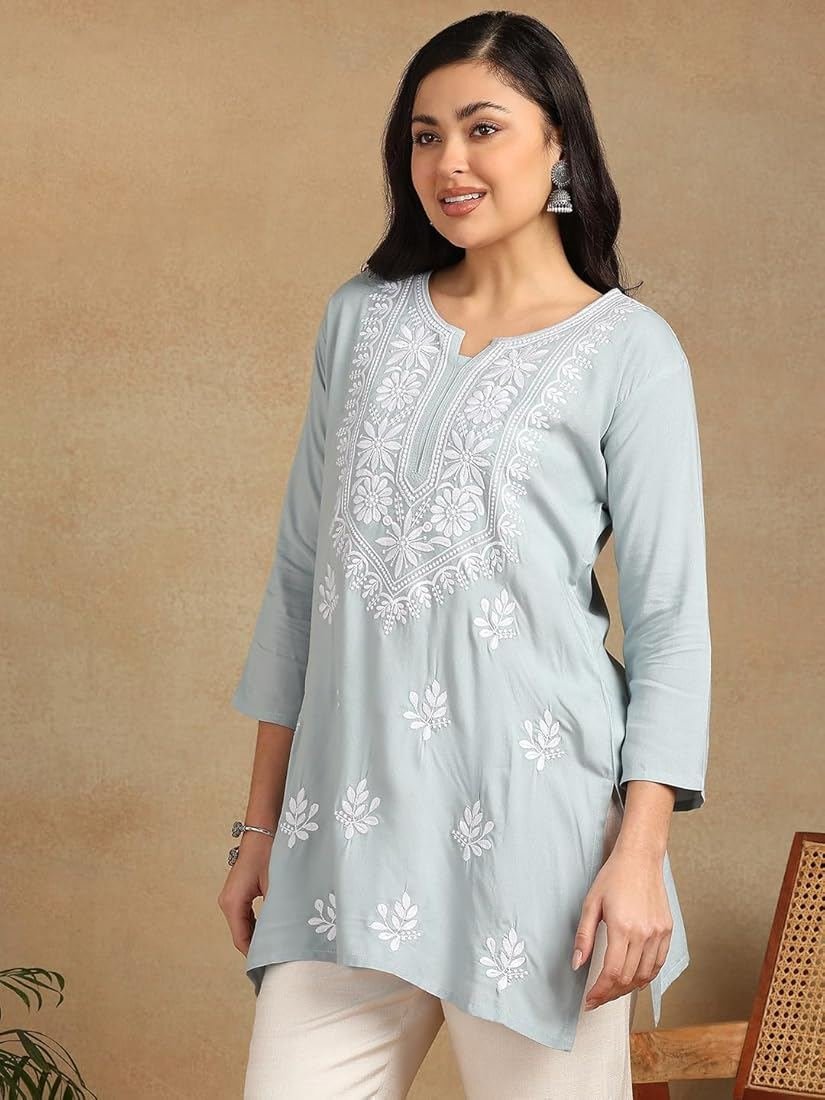 Model wearing pastel blue chikankari tunic kurti