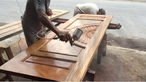 Spray polishing of a carved wooden door — polishing & finishing in Kakori, Lucknow