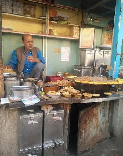 Owner at the chaat counter, Shukla Chaat House Lucknow