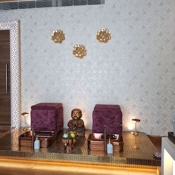 Spa pedicure and massage chairs with Buddha decor at Sugar E Spa