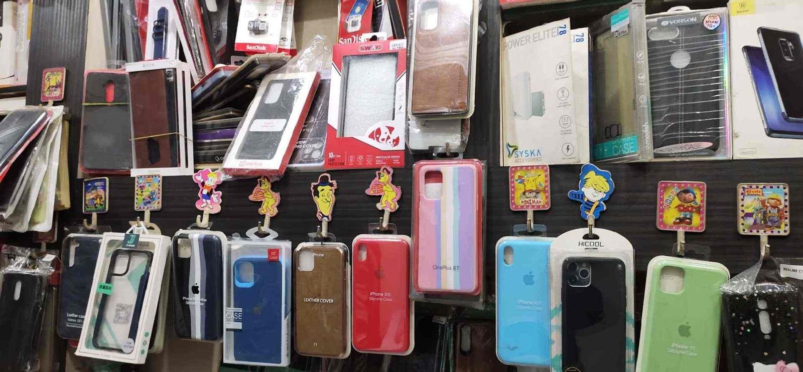 Accessories display wall inside our shop — Sunny Mobile Repairing Centre, Indira Nagar, Lucknow