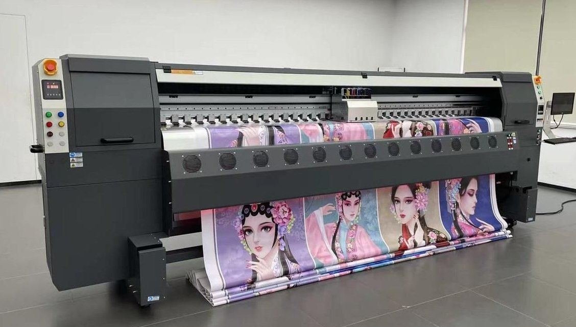 Large-format flex banner printing machine in operation at Tech Print House, printing shop in Aminabad Lucknow