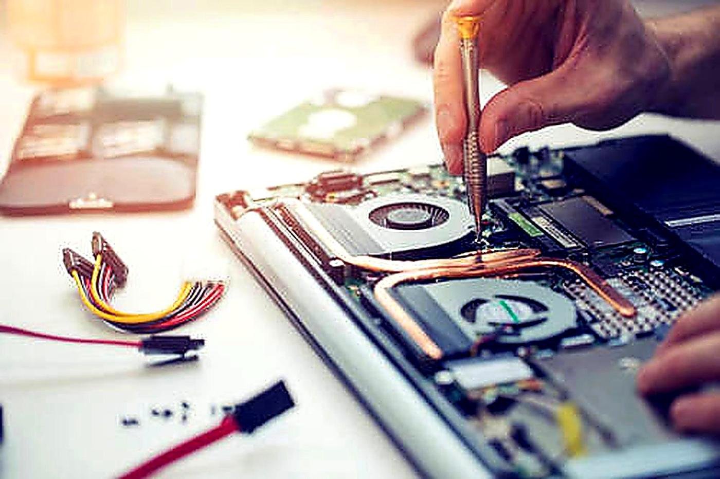 Laptop motherboard repair under magnification — water damage recovery in Indira Nagar, Lucknow
