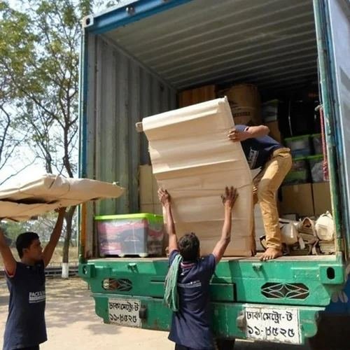 Workers loading furniture into a container truck, Verma Packers and Movers