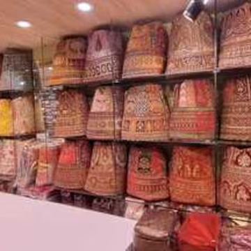 Bridal lehenga display shelves at Vipin Sarees